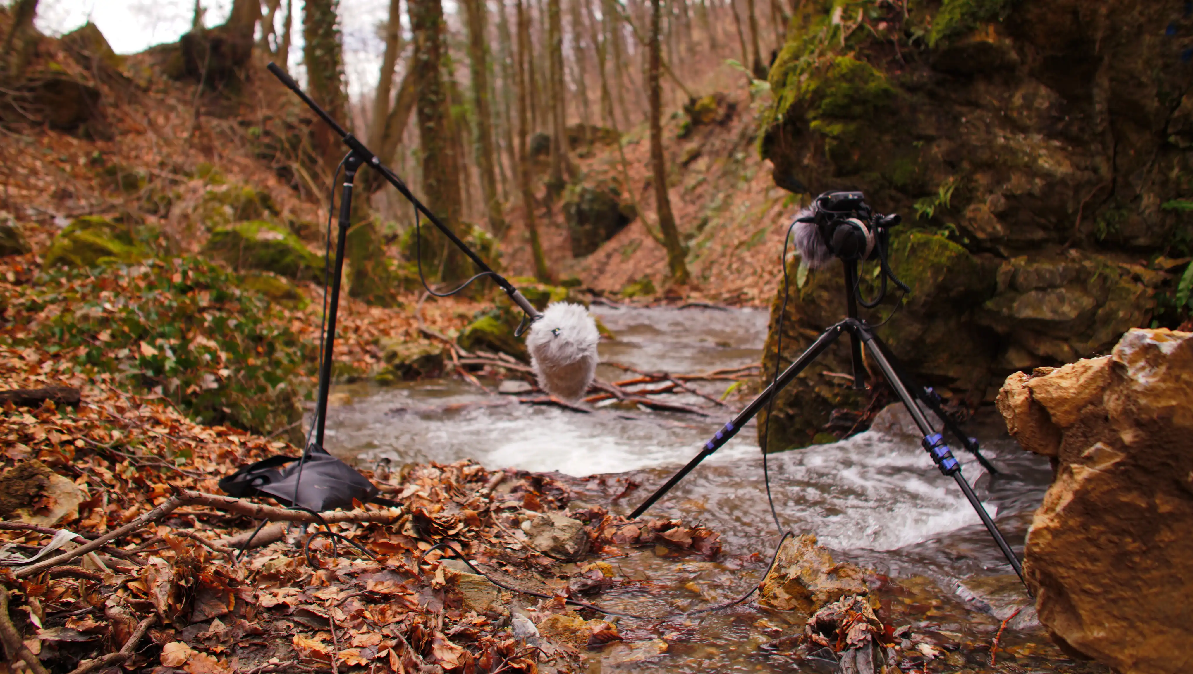 Daniel sitting at the working desk in a garage with a laptop and sound interfce in front of him.
